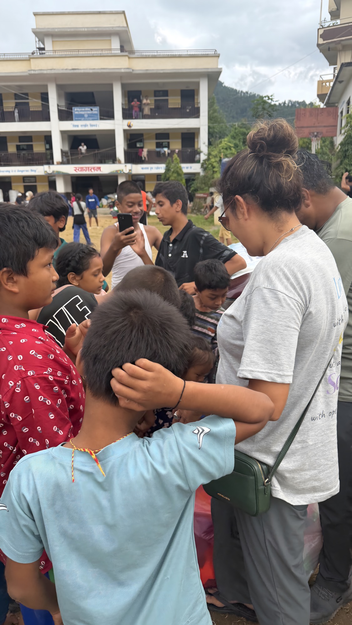 Sajana with children at the holding center