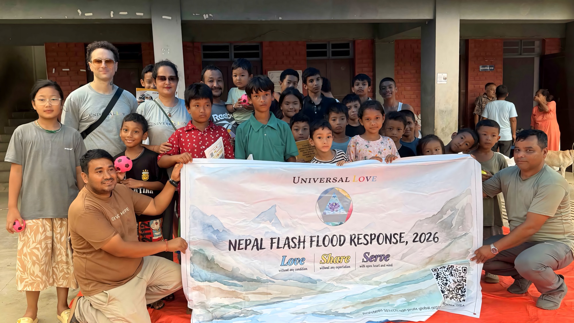 The Universal Love team with children at a flood relief distribution site