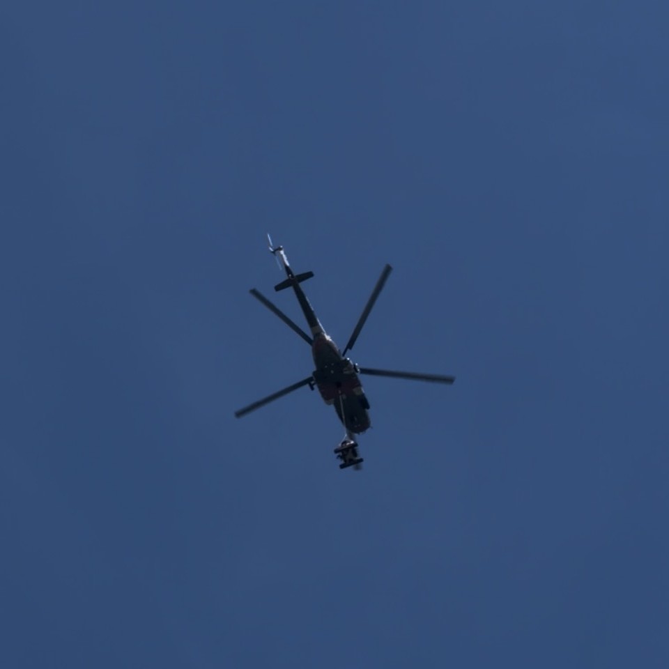 A rescue helicopter over the valley