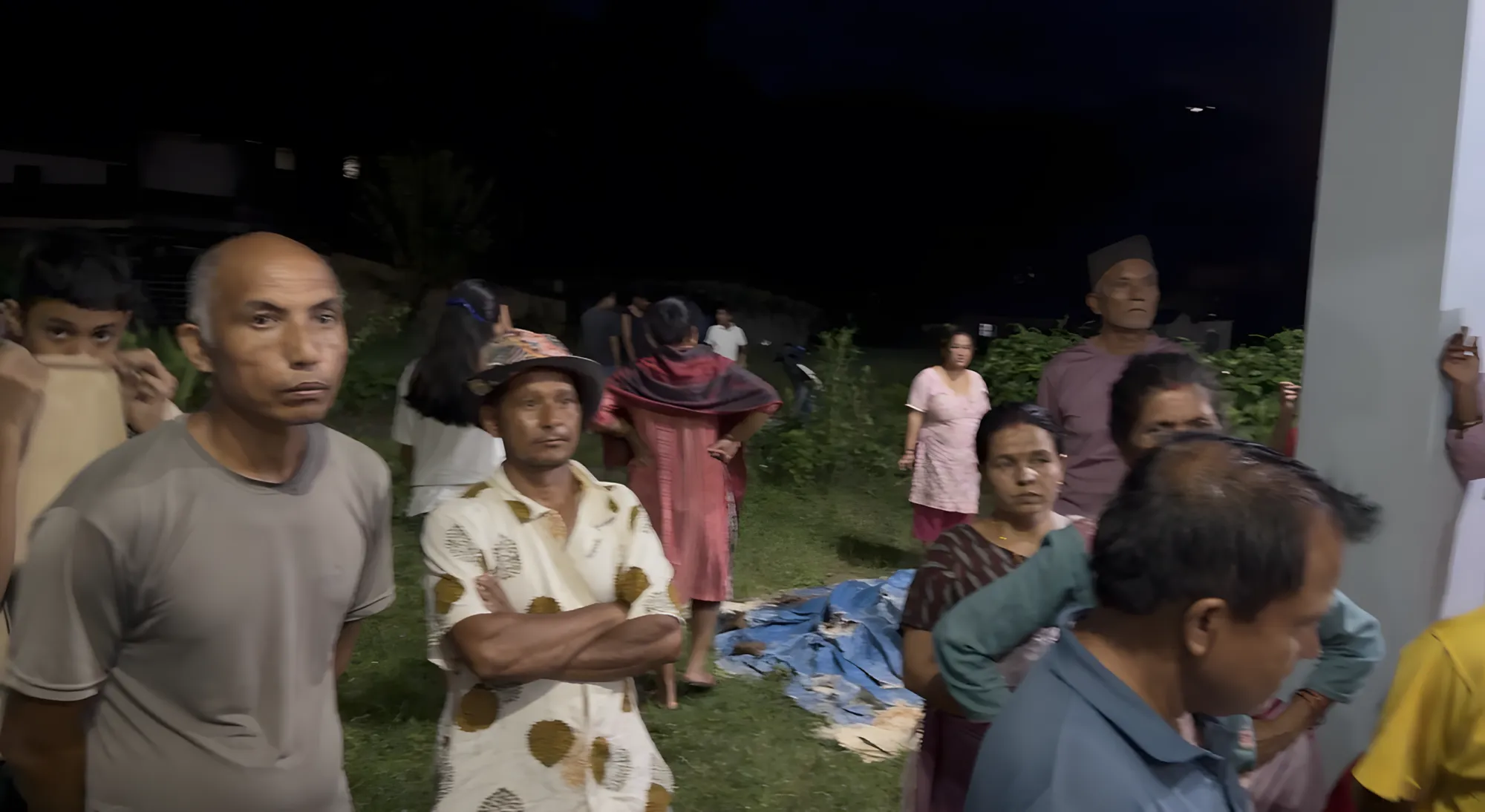 Families gathered for a nighttime distribution