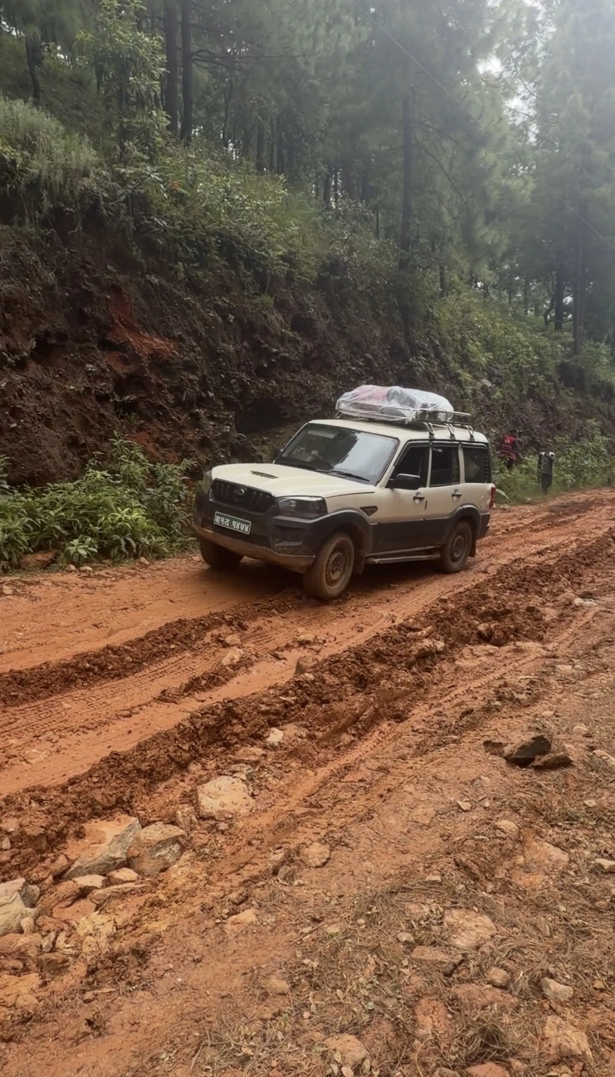 A 4x4 navigating the washed-out back road